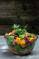 Uzbek food Manti or dumplings made from multi-colored dough. Homemade Uzbek dish. The concept of oriental cuisine, vertical image. top view. place for text