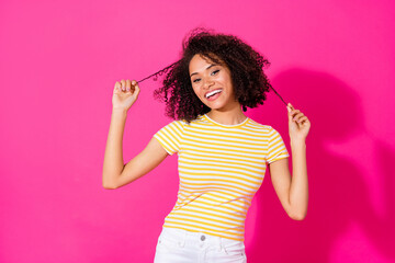 Photo portrait of lovely young woman hold strand perm promo dressed stylish yellow striped outfit...