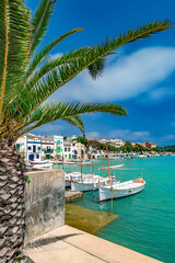 The old port section of Portocolom with boathouses and traditional boats - 2642