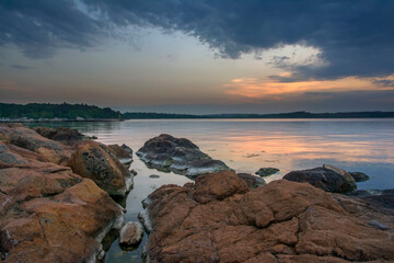 Beautiful colorful sunrise at the sea with dramatic clouds and sun shining. Long Exposure of Soft and colorful sunset.