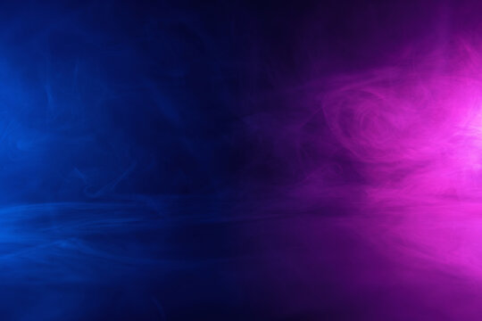 Abstract background scene of blue and pink neon colored smoke clouds