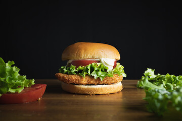 Chicken burger with lettuce and tomato