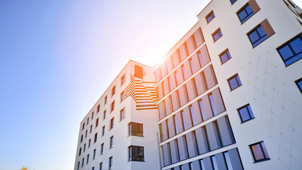 New apartment building on a sunny day. Modern residential architecture. The apartment is waiting for new residents.