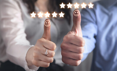 Human making thumb up with a happy smiley face and five star.