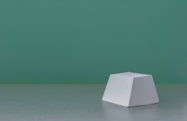 white geometric platform for cosmetics display