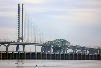 MONTREAL CANADA 10 24 2022:  Samuel De Champlain Bridge an a part of the old bridge is a cable...