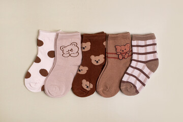 Colorful baby kid socks , different print color for boy and girl. Cloth textile.