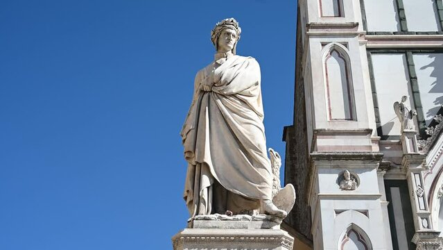 Florence, Italy: Statue Dante Alighieri in Piazza Santa Croce. Monument to Dante Alighieri in front of Basilica of Santa Croce in Firenze.