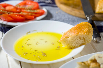 focaccia with tomatoes, cheese, olive oil and other additions