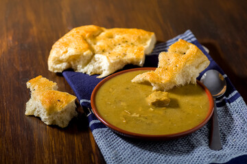 sauce bowl with meat and bread