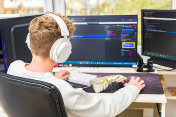 young programmer in front of the computer