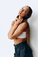 Fototapeta premium A woman with long, wet hair sits with her head tilted back after washing. Taking care of your hair and scalp