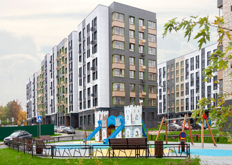 Low-rise houses children playground mixed-use urban multi-family residential district area...