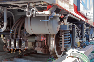 Close up train stop gear with steam locomotive detail, cranks, wheels and braking system with...