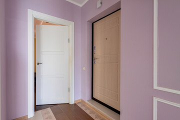 Modern pink corridor with two wooden house doors. Concept of choice.