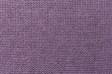 Knitted pattern closeup, detailed yarn background.