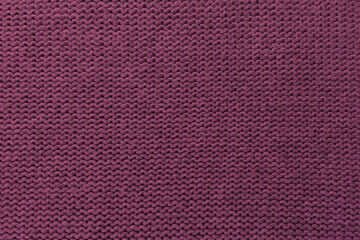 Knitted pattern closeup, detailed yarn background.