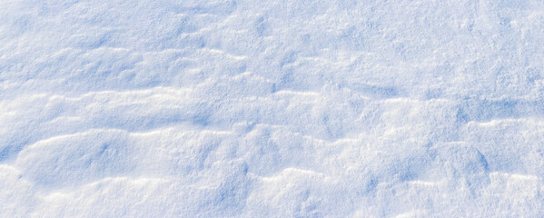 The surface of the snow in sunny weather, the snow lies in layers on the surface of the earth