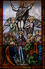 Fototapeta na wymiar Stained glass window representing the ascension of the Lord in cathedral from Targu Mures city Romania 