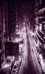 I'm standing on a city street and it's winter evening. The air is cold and there's a bitter wind blowing. I can see my breath in front of me. The streets are empty except for a few cars that pass