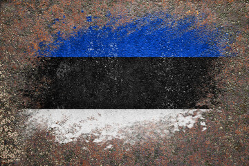 Flag of Estonia. Flag is painted on a rusty surface. Rusty background