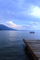 a boat on a blue lake