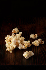Popcorn pile on dark rustic wooden table