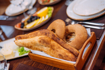 Laid table in the restaurant. Lunch break. Bread on the table in the restaurant.