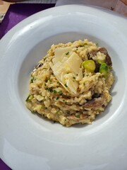 Musrooms and asparagus risotto with parmesano cheese. Rice recipe
