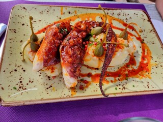 Grilled octopus with potato pure. Galician octopus