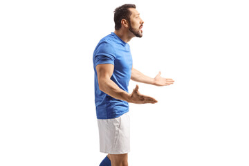 Profile shot of an angry football player gesturing with hands