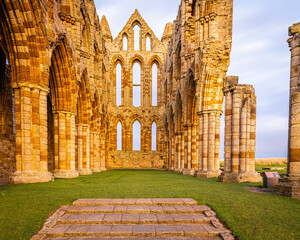 Sunset view of Whitby abbey overlooking the North Sea on the East Cliff above Whitby in North Yorkshire, England