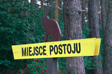 Polish signpost reading "a place to rest" or "a parking lot" ("miejsce postoju")