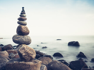 Stones pebbles stacked in a Zen pyramid on Baltic sea coast