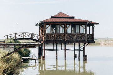 Stilt house on the lake. Bungalow on stilts