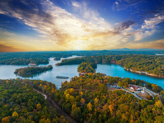 Lake Lanier in North Georgia, 4K aerial drone on a sunny fall day. Radiant clouds both blue and...