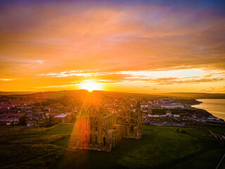 Sunset view of Whitby abbey overlooking the North Sea on the East Cliff above Whitby in North Yorkshire, England