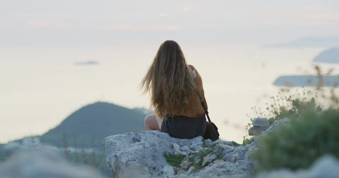 Woman admiring the view from Srd Hill, Croatia