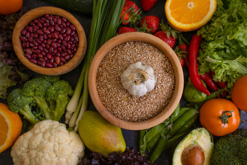 Different vegetables, fruits, cereals on the old background