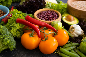 Different vegetables, fruits, cereals on the old background