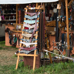 a stall selling leather goods at a medieval market