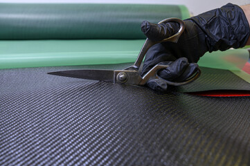 Preparation and cutting of a real carbon fiber sheet for the industrial production of a component...