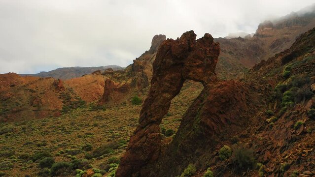 Queen Shoe. Geological feature in Teide National Park. Tenerife, Spain. Hole in mountain rock formation. Volcanic deserted hiking area.
