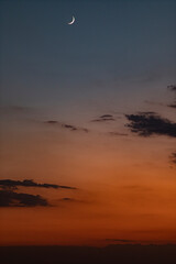 orange sunset clouds with moon