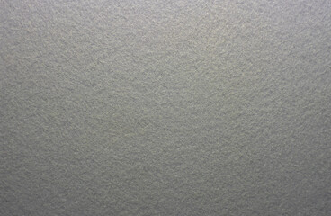 Photo of the texture of gray felt fabric. Soft gray background of high quality.Felt material for production.