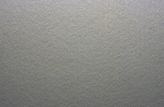 Photo of the texture of gray felt fabric. Soft gray background of high quality.Felt material for production.