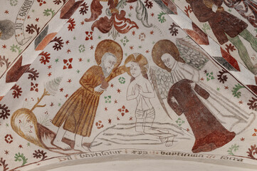 a 500 years old fresco depicting the Baptism of Jesus in the river Jordan