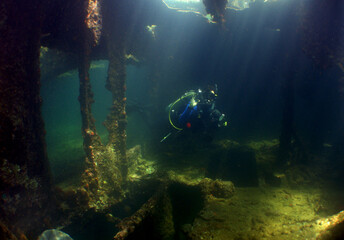 Fototapeta na wymiar underewater scene , scuba diver and ship wreck , caribbean island