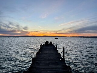 Fototapeta premium sunset on the pier in albufera spain 