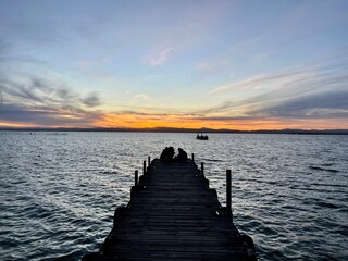 sunset on the pier in albufera spain 